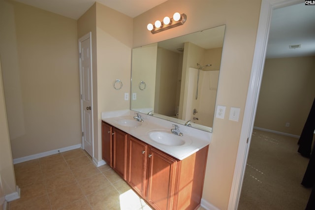 267 Courtside Dr, Lexington, SC 29073 - full bathroom featuring double vanity, baseboards, bathtub / shower combination, and tile patterned flooring