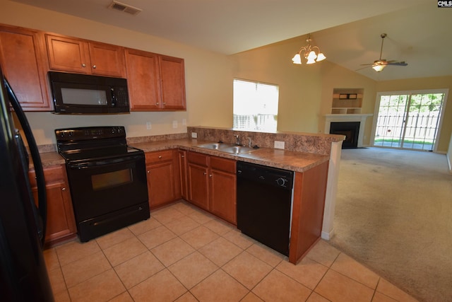 267 Courtside Dr, Lexington, SC 29073 - kitchen with black appliances, a peninsula, brown cabinets, a sink, and a ceiling fan
