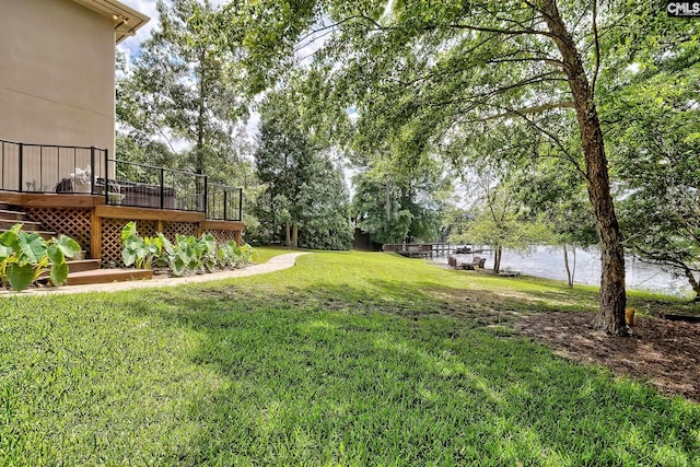 940 Willow Cove Rd, Chapin, SC 29036 - view of green lawn featuring a deck with water view, stairs, and view of wooded area