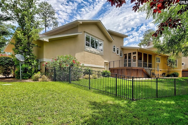 940 Willow Cove Rd, Chapin, SC 29036 - rear view of property with stucco siding, a fenced backyard, a sunroom, and stairway