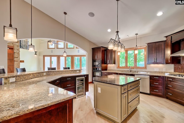 940 Willow Cove Rd, Chapin, SC 29036 - kitchen featuring appliances with stainless steel finishes, beverage cooler, light wood-style flooring, a large island, and recessed lighting