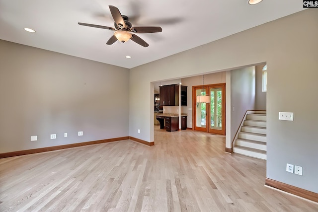 940 Willow Cove Rd, Chapin, SC 29036 - unfurnished living room featuring a ceiling fan, light wood-style floors, stairs, and recessed lighting