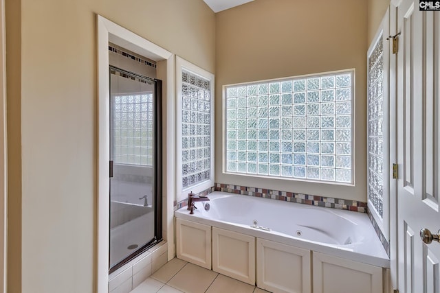 940 Willow Cove Rd, Chapin, SC 29036 - full bathroom with a stall shower, a jetted tub, and tile patterned floors