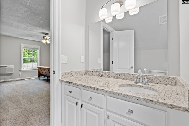 525 Willow Bend Ct, Columbia, SC 29212 - bathroom featuring vanity, ceiling fan, a textured ceiling, a wall unit AC, and baseboards