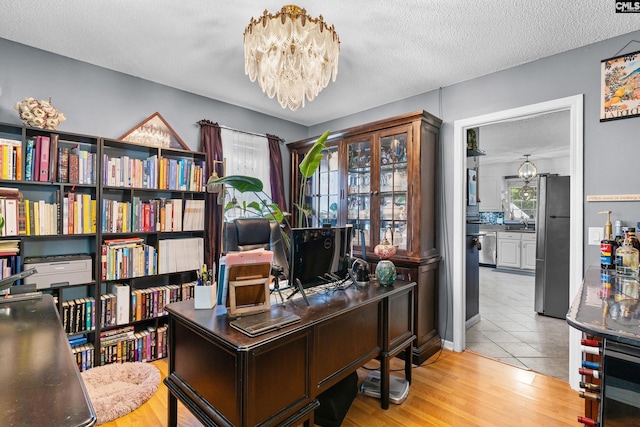 336 S Royal Tower Dr, Irmo, SC 29063 - office with a chandelier, a textured ceiling, and wood finished floors