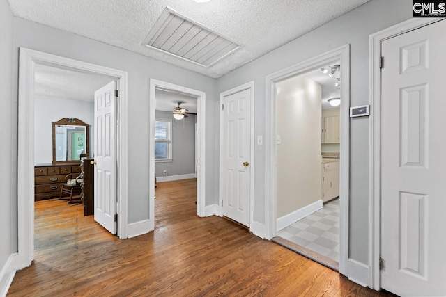 26 Carroll Ct, West Columbia, SC 29170 - corridor with a textured ceiling, wood finished floors, and baseboards
