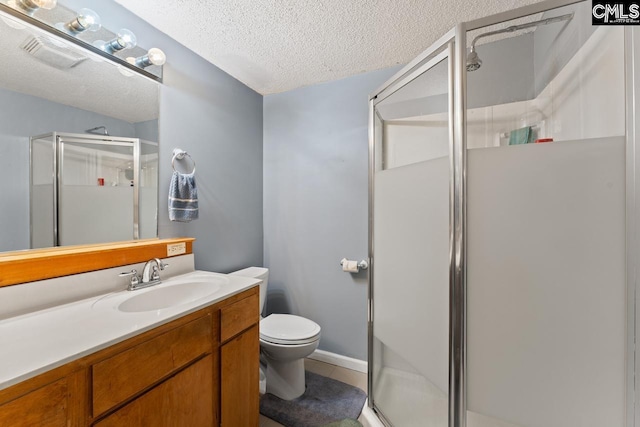 26 Carroll Ct, West Columbia, SC 29170 - full bathroom featuring a shower stall, vanity, a textured ceiling, toilet, and tile patterned flooring