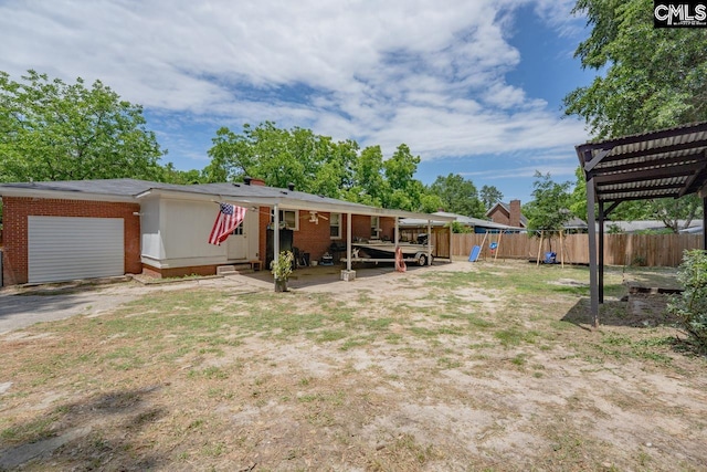 26 Carroll Ct, West Columbia, SC 29170 - view of yard with a pergola, an attached garage, and a playground