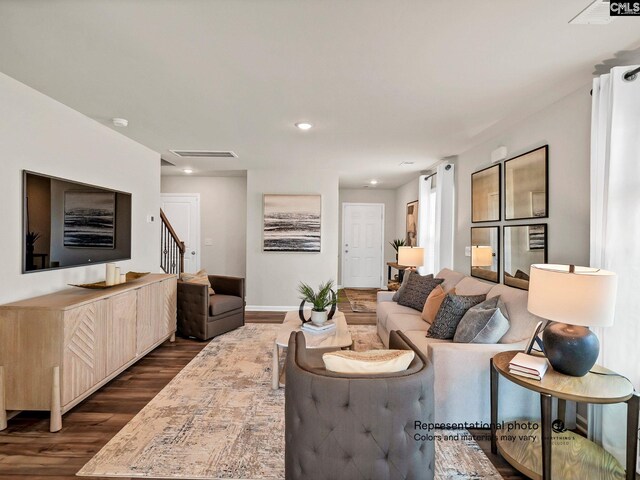 219 Bones Rd, Gilbert, SC 29054 - living room featuring dark wood-style flooring, stairs, baseboards, and recessed lighting