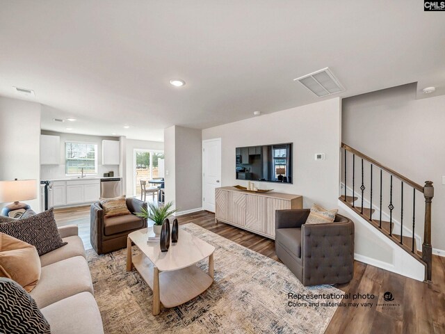 219 Bones Rd, Gilbert, SC 29054 - living area featuring wood finished floors, recessed lighting, baseboards, and stairway