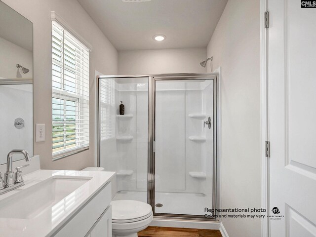 219 Bones Rd, Gilbert, SC 29054 - bathroom featuring a shower stall, vanity, toilet, recessed lighting, and wood finished floors