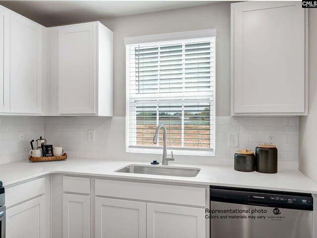 219 Bones Rd, Gilbert, SC 29054 - kitchen with stainless steel dishwasher, a sink, white cabinets, and decorative backsplash