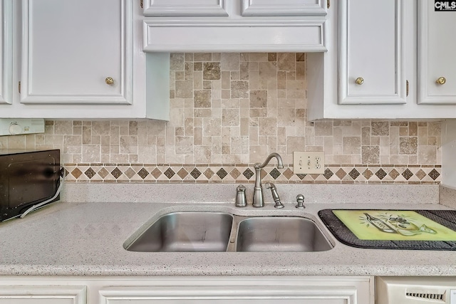 148 Lake Murray Ter, Lexington, SC 29072 - kitchen featuring a sink, white cabinetry, tasteful backsplash, and light stone countertops