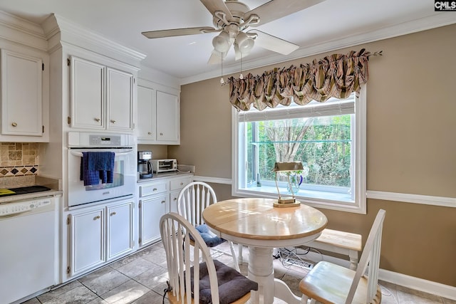 148 Lake Murray Ter, Lexington, SC 29072 - dining space with a ceiling fan, ornamental molding, baseboards, and light tile patterned flooring