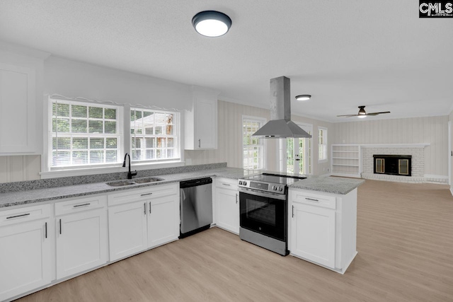 248 Shareditch Rd, Columbia, SC 29210 - kitchen with stainless steel appliances, island exhaust hood, a sink, light wood-style floors, and plenty of natural light