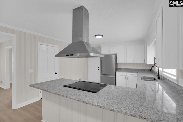248 Shareditch Rd, Columbia, SC 29210 - kitchen featuring freestanding refrigerator, island exhaust hood, a sink, black electric cooktop, and white cabinetry