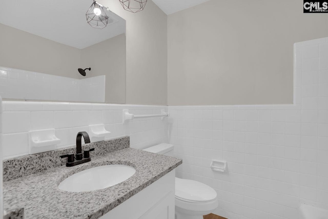 248 Shareditch Rd, Columbia, SC 29210 - full bath featuring tile walls, toilet, vanity, a shower, and wainscoting