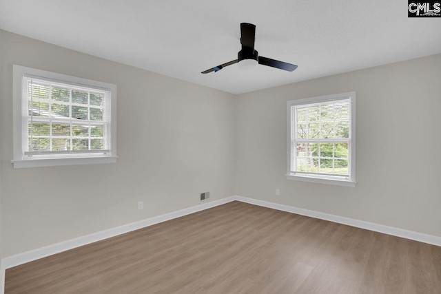 248 Shareditch Rd, Columbia, SC 29210 - empty room featuring wood finished floors, healthy amount of natural light, baseboards, and ceiling fan