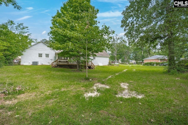 248 Shareditch Rd, Columbia, SC 29210 - view of grassy yard with a wooden deck and central AC