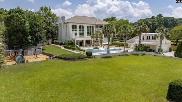 520 Sail Point Way, Columbia, SC 29212 - back of property featuring a balcony, a chimney, a playground, an outdoor pool, and a patio