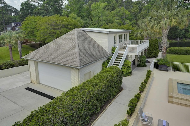 520 Sail Point Way, Columbia, SC 29212 - view of property exterior with roof with shingles, brick siding, stairs, a deck, and a garage