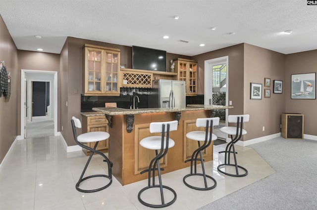 520 Sail Point Way, Columbia, SC 29212 - indoor wet bar featuring stainless steel fridge, a textured ceiling, tasteful backsplash, baseboards, and recessed lighting