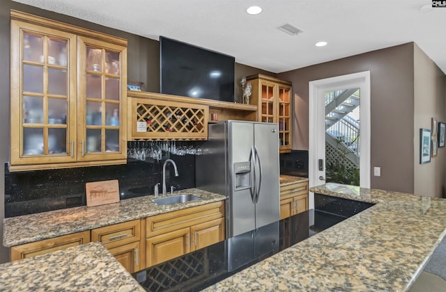 520 Sail Point Way, Columbia, SC 29212 - kitchen featuring a sink, stainless steel fridge with ice dispenser, stone counters, glass insert cabinets, and recessed lighting