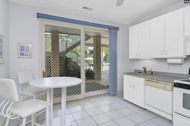 520 Sail Point Way, Columbia, SC 29212 - kitchen with white appliances, a sink, white cabinets, light tile patterned flooring, and light countertops