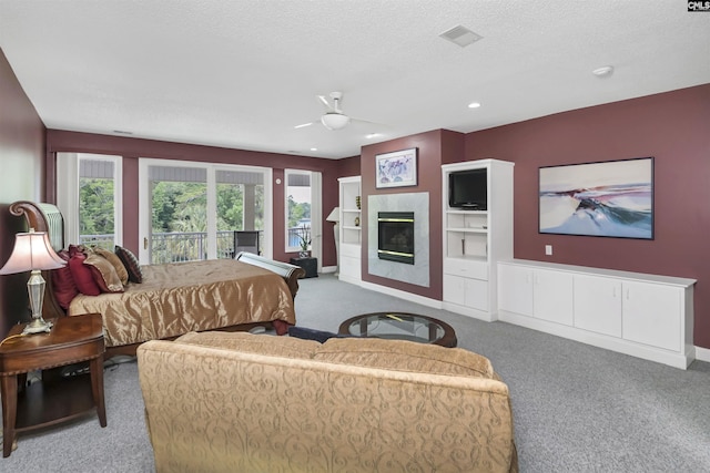 520 Sail Point Way, Columbia, SC 29212 - carpeted bedroom featuring access to exterior, a glass covered fireplace, baseboards, a textured ceiling, and recessed lighting