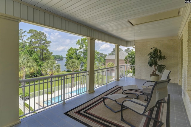 520 Sail Point Way, Columbia, SC 29212 - sunroom with tile patterned flooring, plenty of natural light, a water view, and brick wall