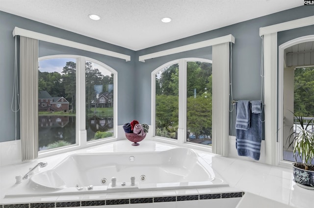 520 Sail Point Way, Columbia, SC 29212 - bathroom with a whirlpool tub, a textured ceiling, and recessed lighting