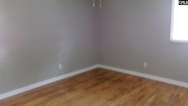 3208 Downes Grove Rd, Columbia, SC 29209 - empty room featuring wood finished floors and baseboards