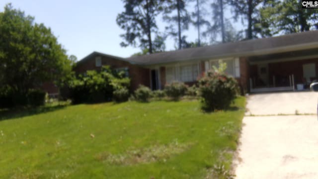 3208 Downes Grove Rd, Columbia, SC 29209 - ranch-style house featuring driveway, a front lawn, and a carport