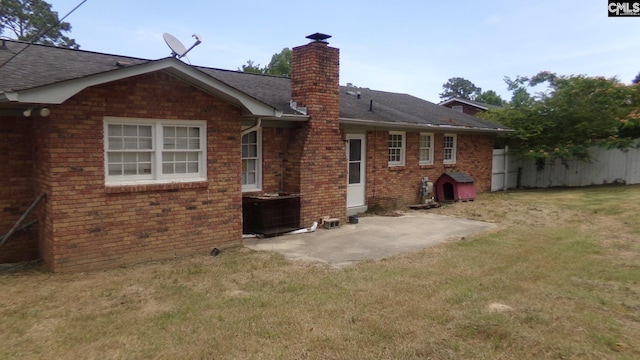 3208 Downes Grove Rd, Columbia, SC 29209 - rear view of house with a chimney, a patio area, brick siding, and a shingled roof