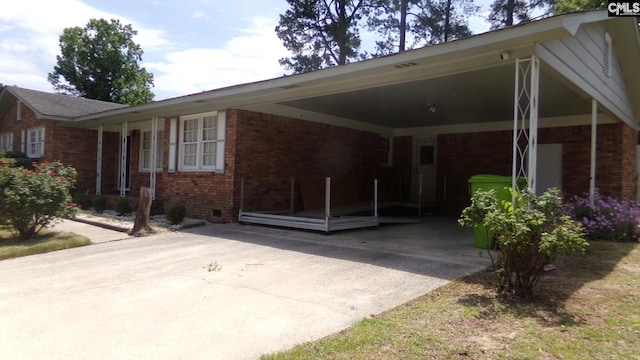 3208 Downes Grove Rd, Columbia, SC 29209 - view of front of home with brick siding, driveway, a carport, and crawl space