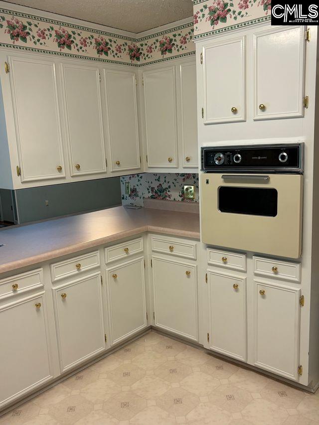 100 Clee Hill Ct, Irmo, SC 29063 - kitchen featuring white oven and light countertops