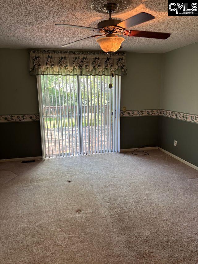 100 Clee Hill Ct, Irmo, SC 29063 - empty room featuring ceiling fan, carpet flooring, a textured ceiling, and baseboards