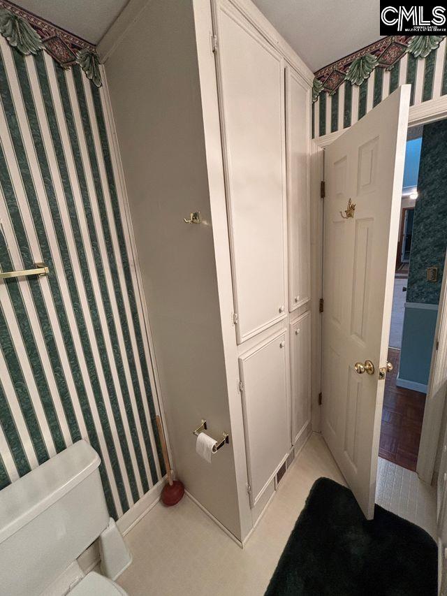 100 Clee Hill Ct, Irmo, SC 29063 - bathroom featuring wallpapered walls, toilet, and baseboards