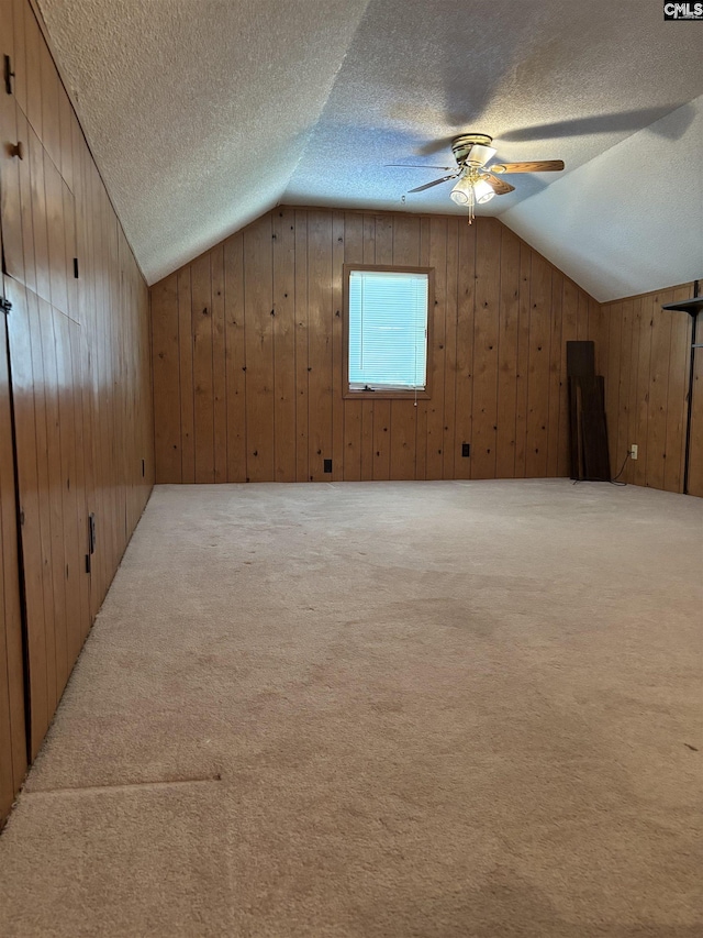 100 Clee Hill Ct, Irmo, SC 29063 - additional living space featuring a textured ceiling, lofted ceiling, carpet, wood walls, and ceiling fan