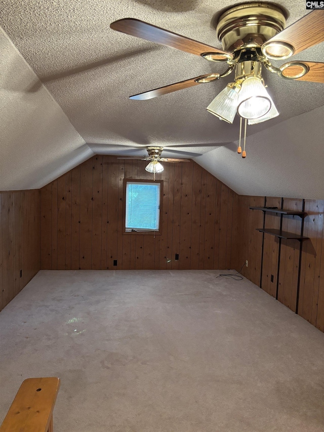 100 Clee Hill Ct, Irmo, SC 29063 - additional living space with a ceiling fan, lofted ceiling, wood walls, carpet, and a textured ceiling