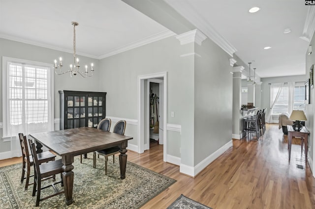 128 Van Der Horst Dr, Columbia, SC 29229 - dining space with a chandelier, ornamental molding, light wood finished floors, baseboards, and recessed lighting