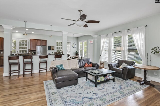 128 Van Der Horst Dr, Columbia, SC 29229 - living area with decorative columns, ceiling fan, light wood-style flooring, plenty of natural light, and recessed lighting