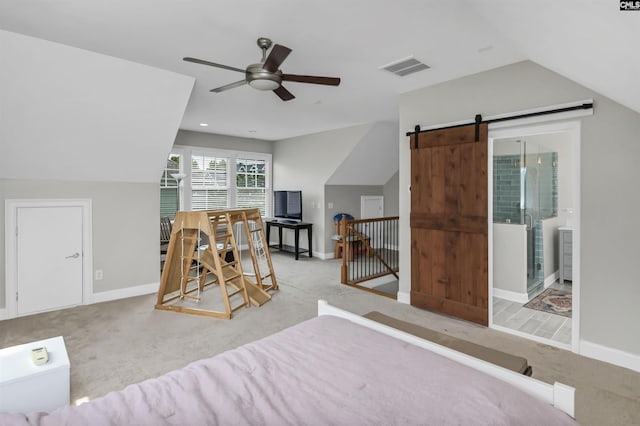 128 Van Der Horst Dr, Columbia, SC 29229 - carpeted bedroom with lofted ceiling, a barn door, and baseboards
