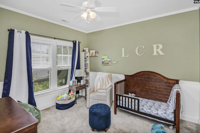 128 Van Der Horst Dr, Columbia, SC 29229 - carpeted bedroom featuring ornamental molding, a crib, a ceiling fan, and wainscoting