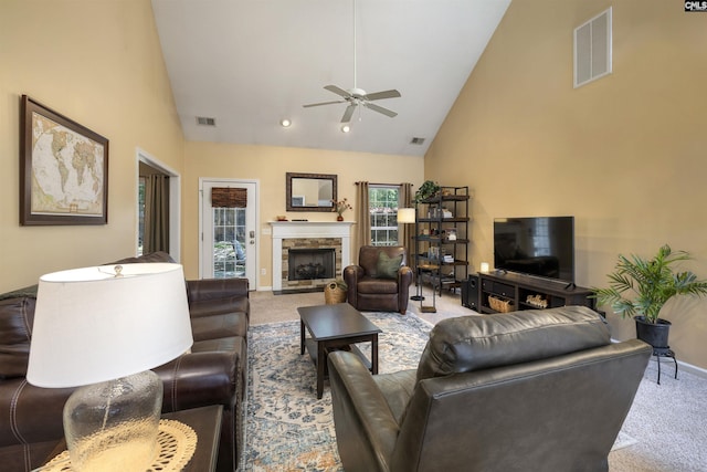 301 Spring Mist Ct, Lexington, SC 29072 - carpeted living room featuring ceiling fan, high vaulted ceiling, baseboards, and a stone fireplace