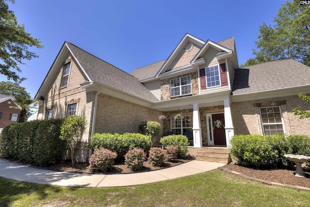 301 Spring Mist Ct, Lexington, SC 29072 - craftsman inspired home with covered porch, roof with shingles, and brick siding