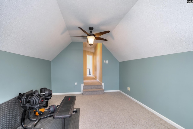 301 Spring Mist Ct, Lexington, SC 29072 - exercise room with ceiling fan, lofted ceiling, a textured ceiling, baseboards, and carpet flooring