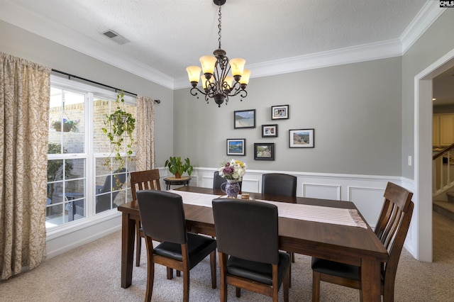 301 Spring Mist Ct, Lexington, SC 29072 - dining space featuring ornamental molding, a chandelier, light colored carpet, wainscoting, and stairs