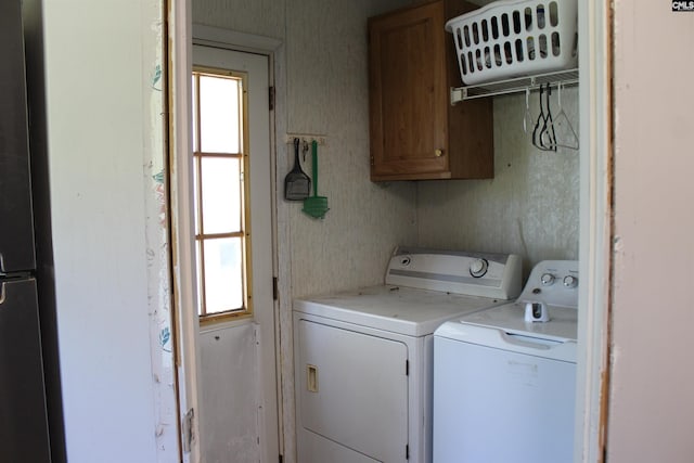 35 Wood Lake Dr, Lugoff, SC 29078 - laundry room featuring independent washer and dryer, healthy amount of natural light, and cabinet space