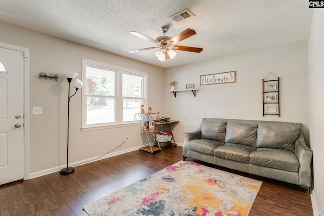 317 Westbridge Rd, Columbia, SC 29223 - living room featuring a ceiling fan, wood finished floors, a textured ceiling, and baseboards